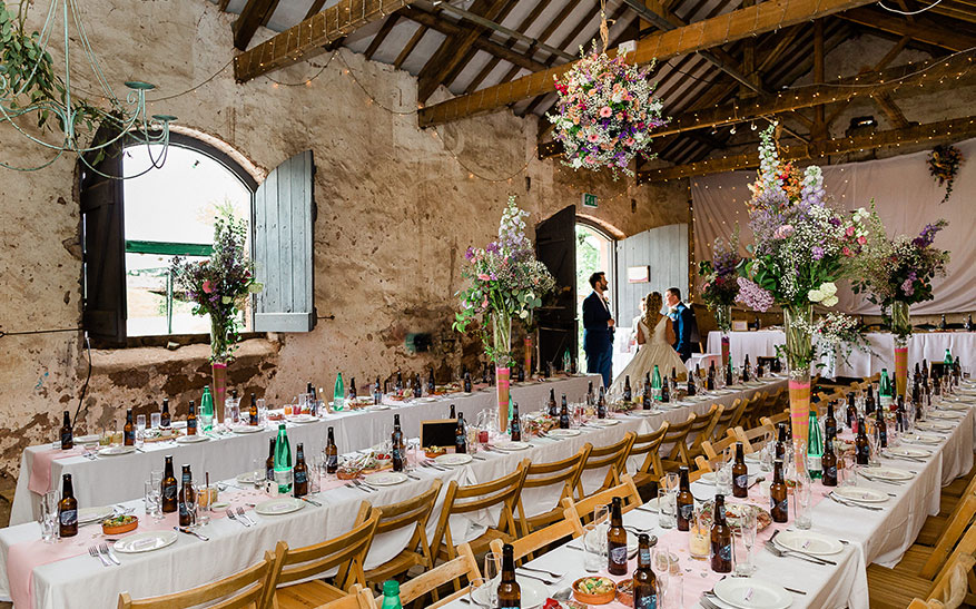 Inside the barn with table ready for the guests