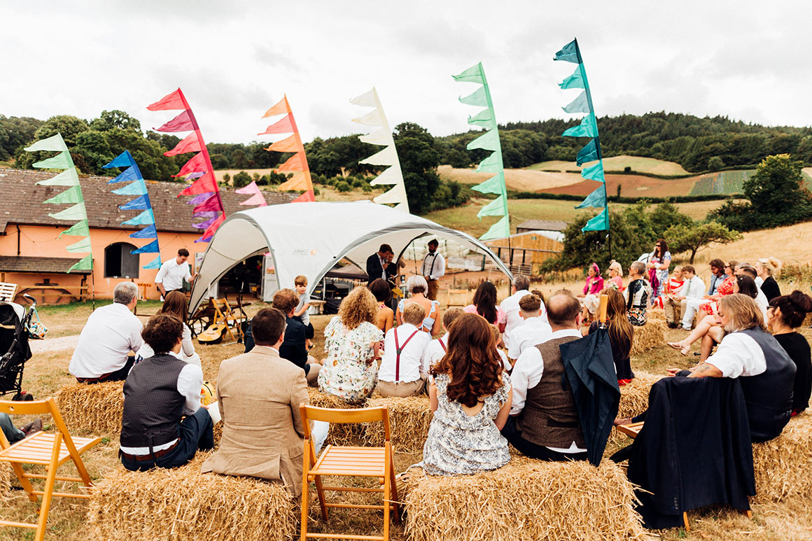 Guests listen to music outside the barn