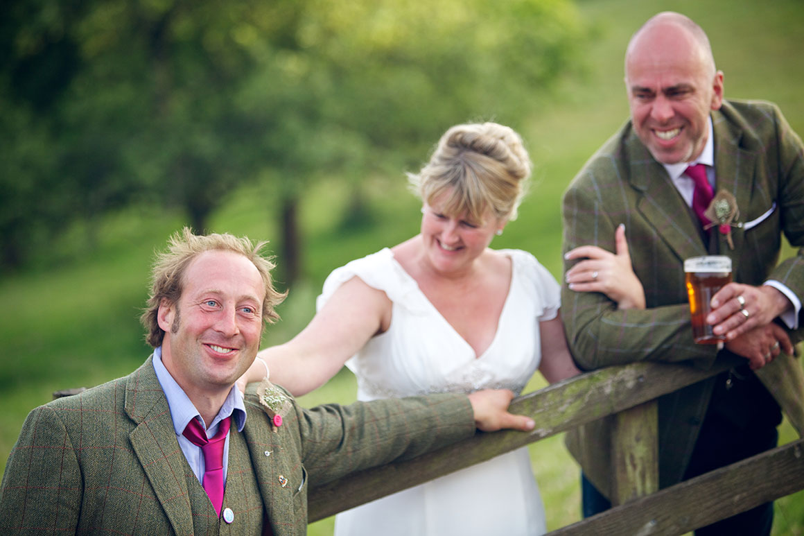 Bestman, bride and groom enjoy a joke